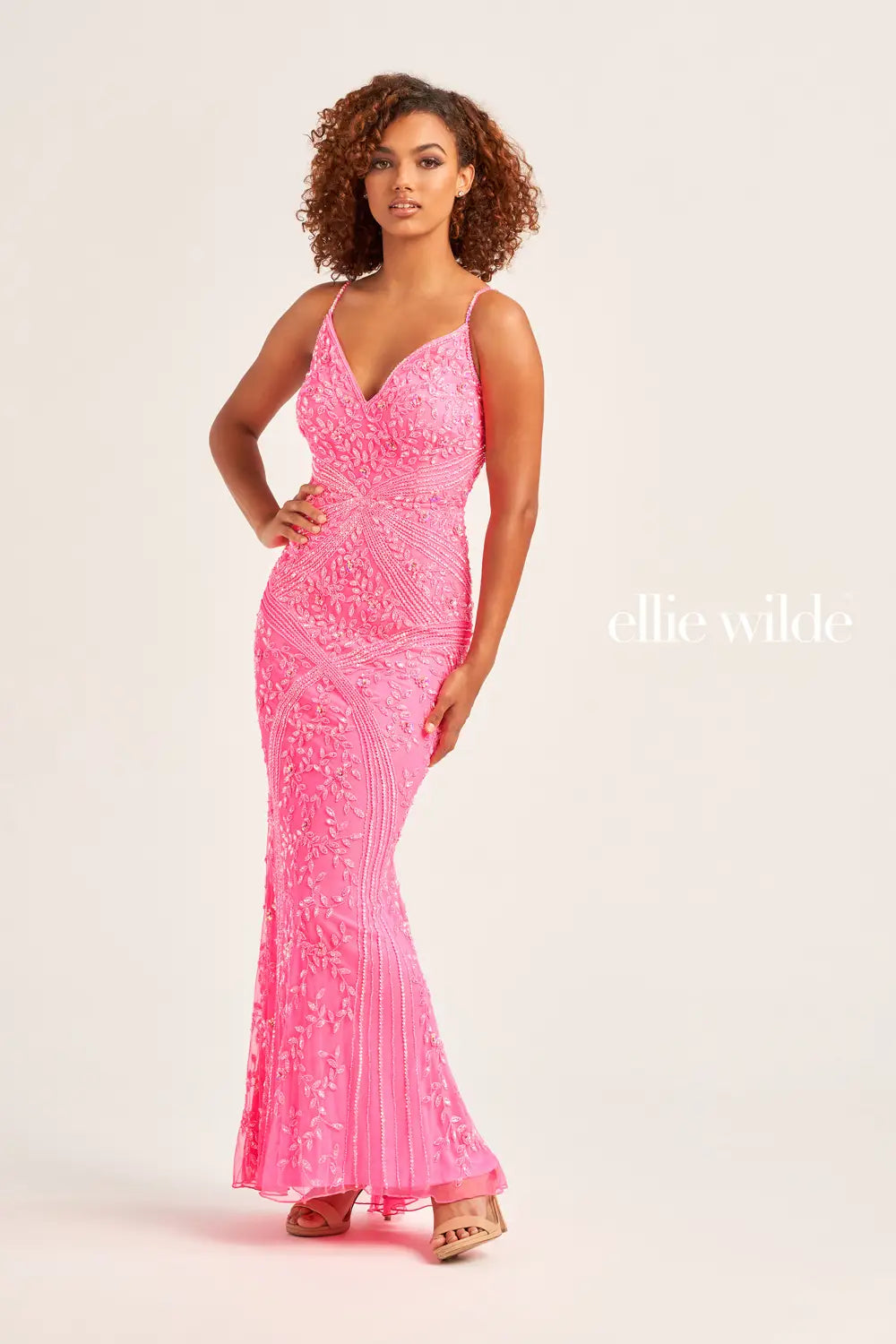 Have an everlasting sparkle when you wear this fully beaded Ellie Wilde prom dress EW35065. This fitted dress features an adjustable fitted bodice with a V-neckline that features adjustable shoulder straps for the perfect fit. Symmetrically sewn beaded patterns give you a radiant shine throughout the entire dress.