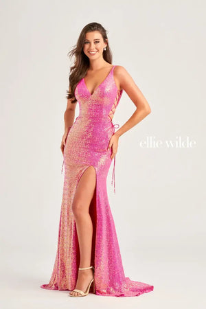 Feel like you're walking the runway in this incredible dress by Ellie Wilde, style EW35235. This vibrant dress comes in multiple colors such as orange, Fuchsia/hot pink, and a stunning shade of light blue. The fabulous sequins details and V-shaped neckline are a must have when choosing your dream prom dress and the long train with a slit is just an incredible bonus.