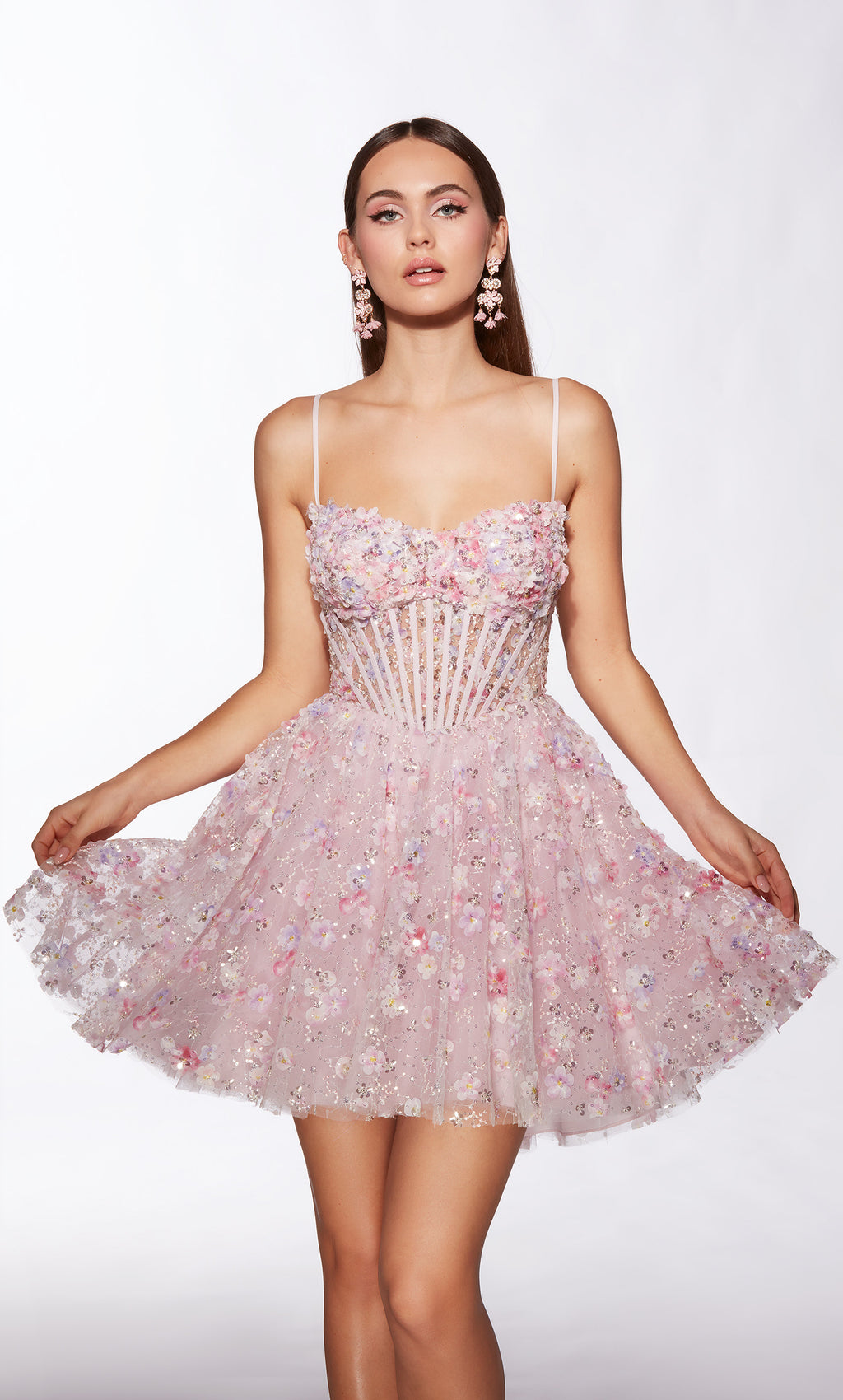 Woman wearing a pink floral dress on a white background