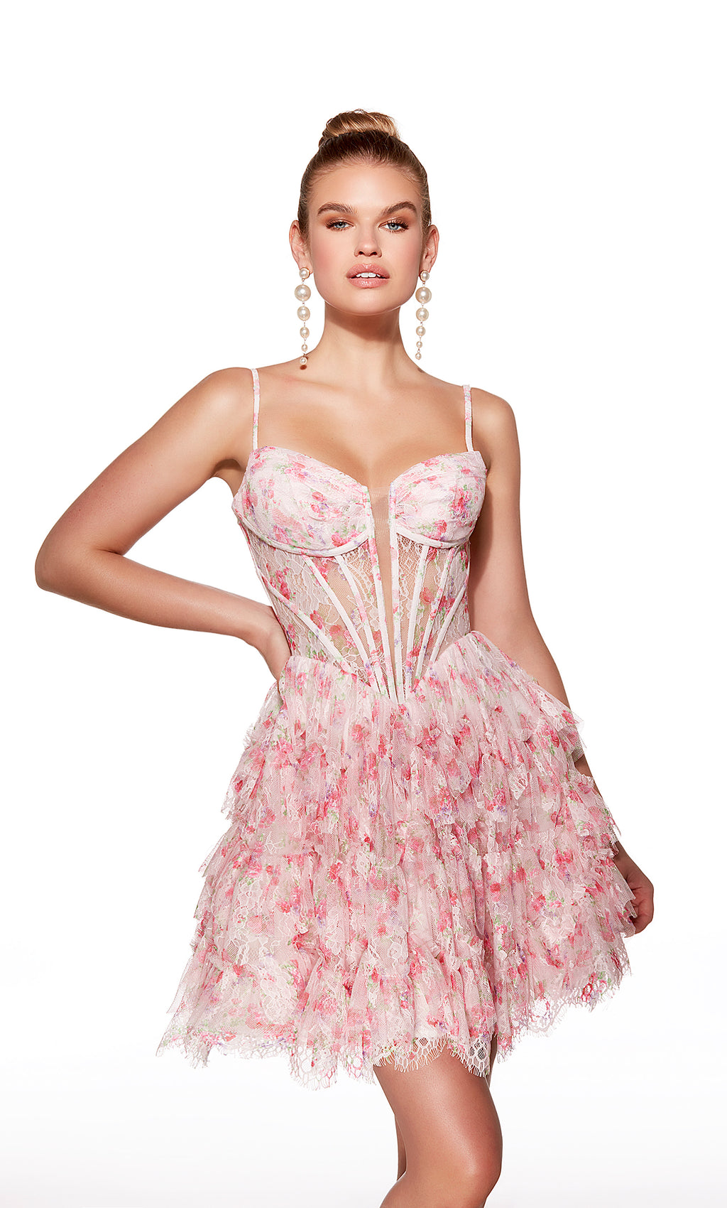 Woman wearing a pink floral lace dress on a white background