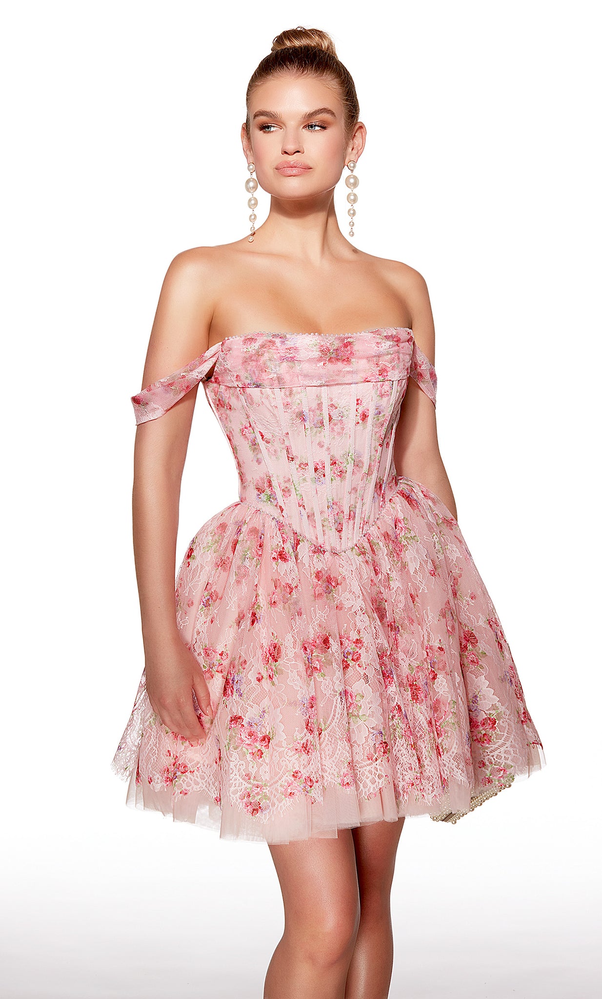Woman wearing a pink floral dress on a white background