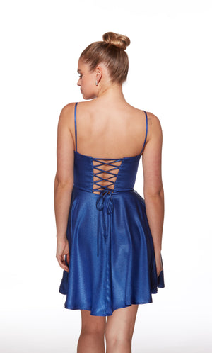 Blue dress with lace-up back worn by a model on a white background