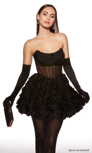 Woman wearing a black strapless dress with floral details and black gloves on a white background