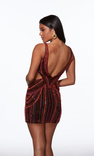 Woman wearing a red and black patterned dress with a backless design on a white background