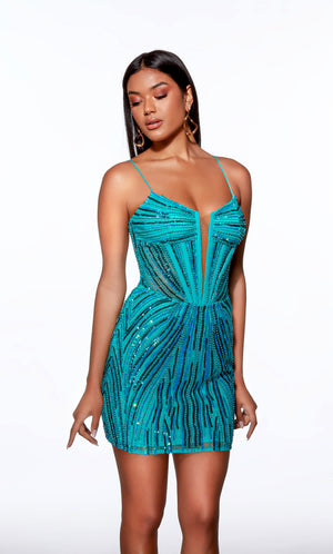 Woman wearing a turquoise sequin dress on a white background