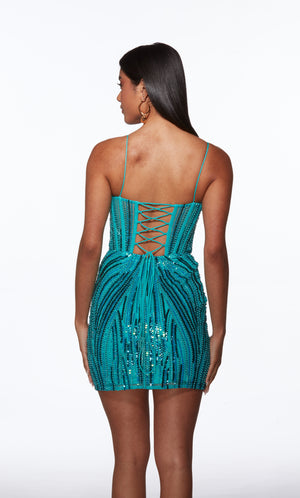 Teal sequin dress with thin straps and lace-up back on a white background