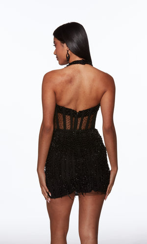 Black strappy dress worn by a model on a white background