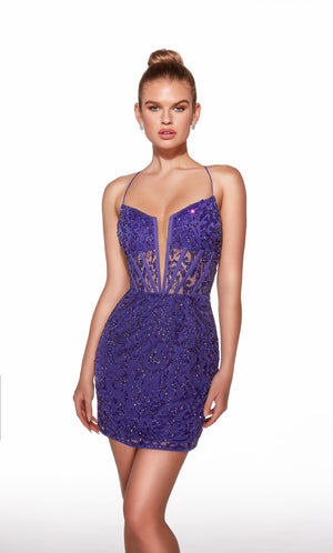 Purple sequin dress worn by a model on a white background