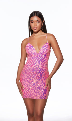 Model wearing a pink and purple patterned dress on a white background