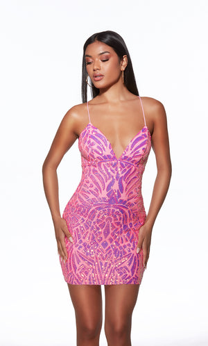 Woman wearing a pink and purple patterned dress on a white background