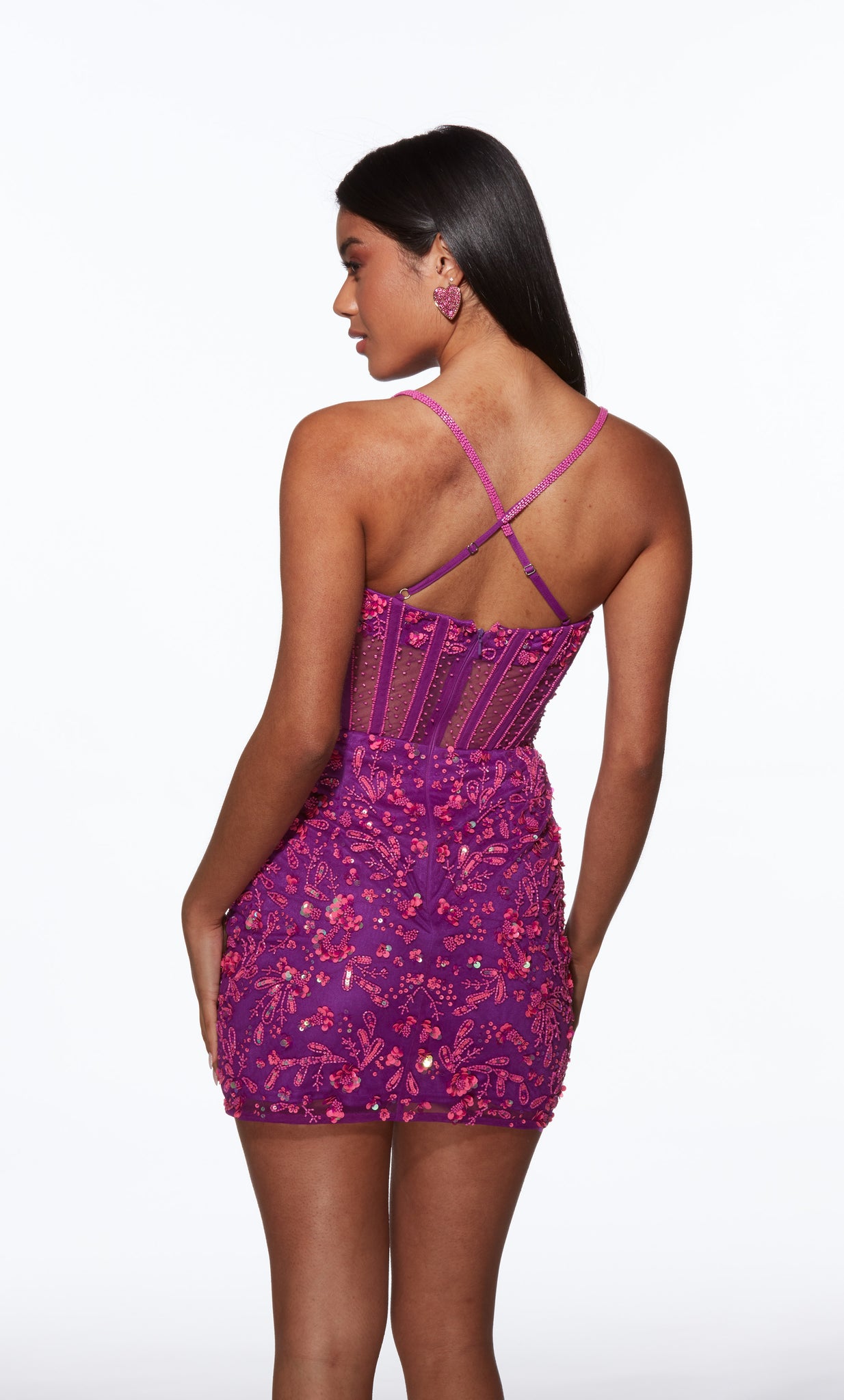 Woman wearing a purple lace dress with a white background