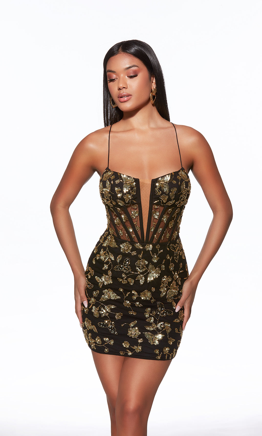 Woman wearing a black and gold sequin dress on a white background