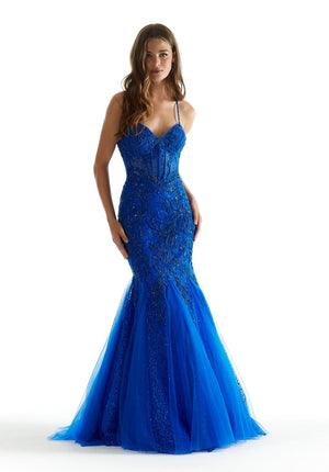 Have all jaws drop as you walk into your next special event while wearing this fabulous long dress by Morilee. style 47085. Showcasing a gorgeous fitted mermaid silhouette with a sweetheart neckline. The corset bodice of this ensemble is sure to hug your body gorgeously. This number is fully adorned with dazzling beadwork and beautiful applique.