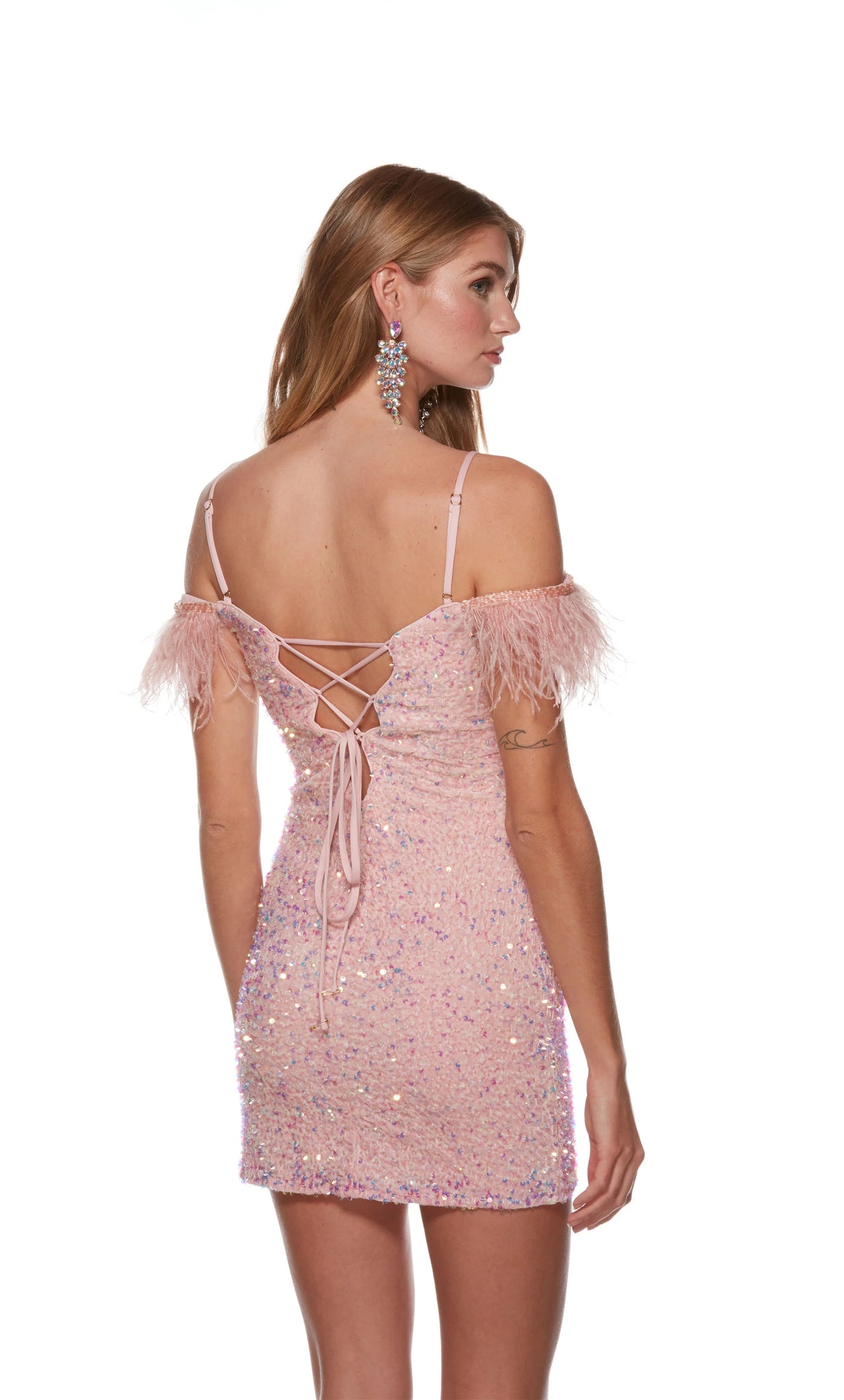 Stop the show as you walk in wearing short fitted dress style 4759 by Alyce Paris. This short fitted dress showcases an off the shoulder neckline with fun feathered cap sleeves. The dress also features thin straps that lead to an open back with a corset lace up that is adjustable to your own liking. The fun beadwork and sequins all around the dress will make you shine through the night.