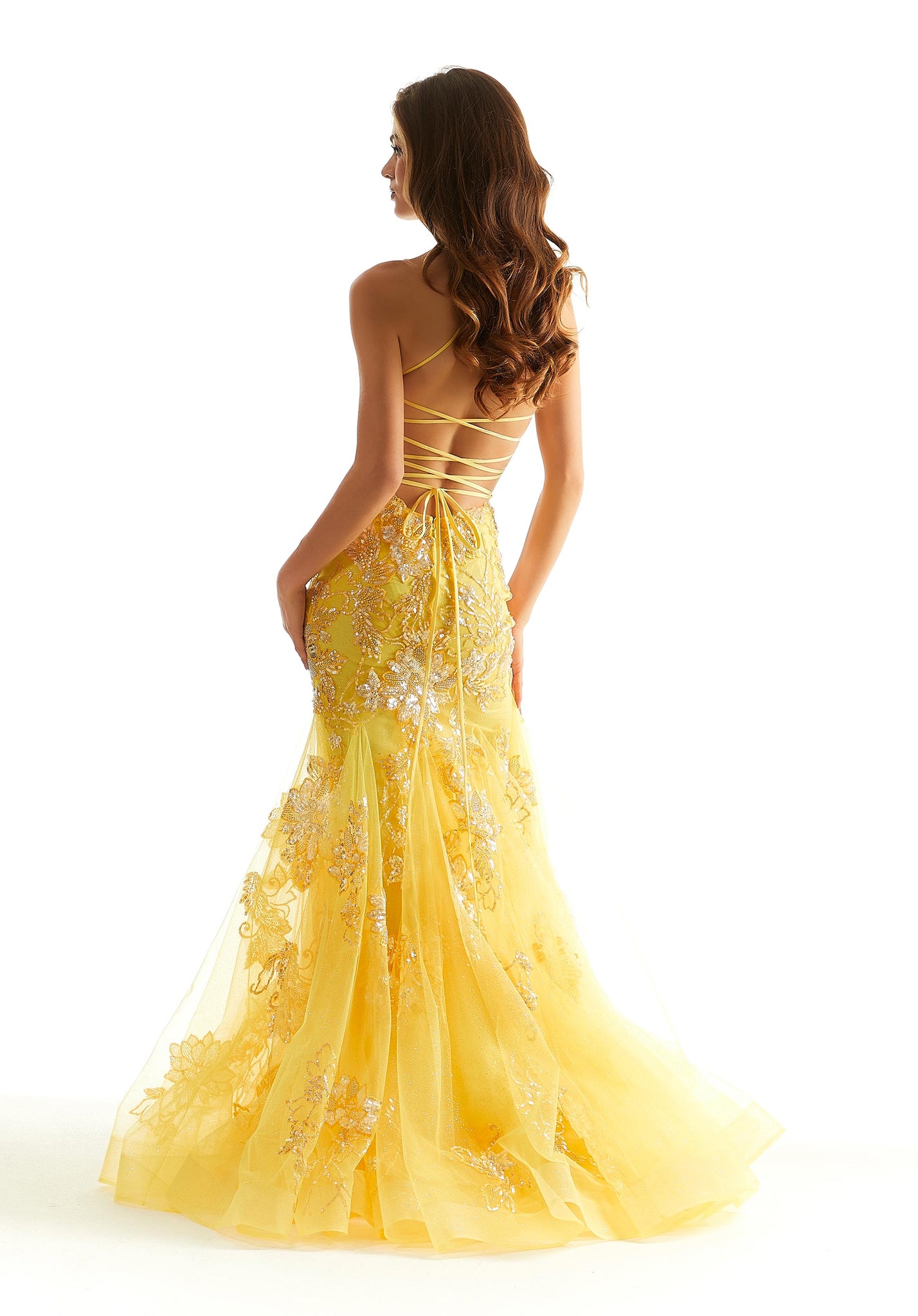 Make a lasting impression in this gorgeous Morilee mermaid dress 48029. This sheer illusion bodice has a scoop style neckline with thin shoulder straps that turn into an adjustable criss cross over your open back. The stunning floral appliques are adorn with sparkling beadwork. The mermaid style skirt trickles down those appliques completing this ultra glam look.