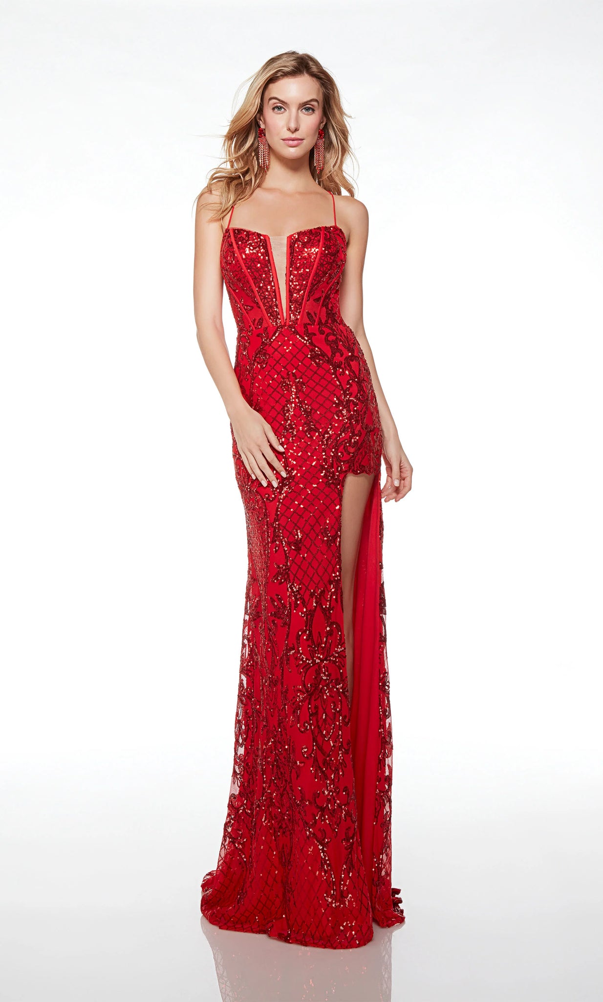 Alyce Paris 61482 column-style formal gown features a corset bodice with a narrow plunging neckline and spaghetti straps that crisscross over the laced-up back. The high cutaway slit with an illusion inset adds flair to this patterned sequin prom dress, finished off with a sweep train.