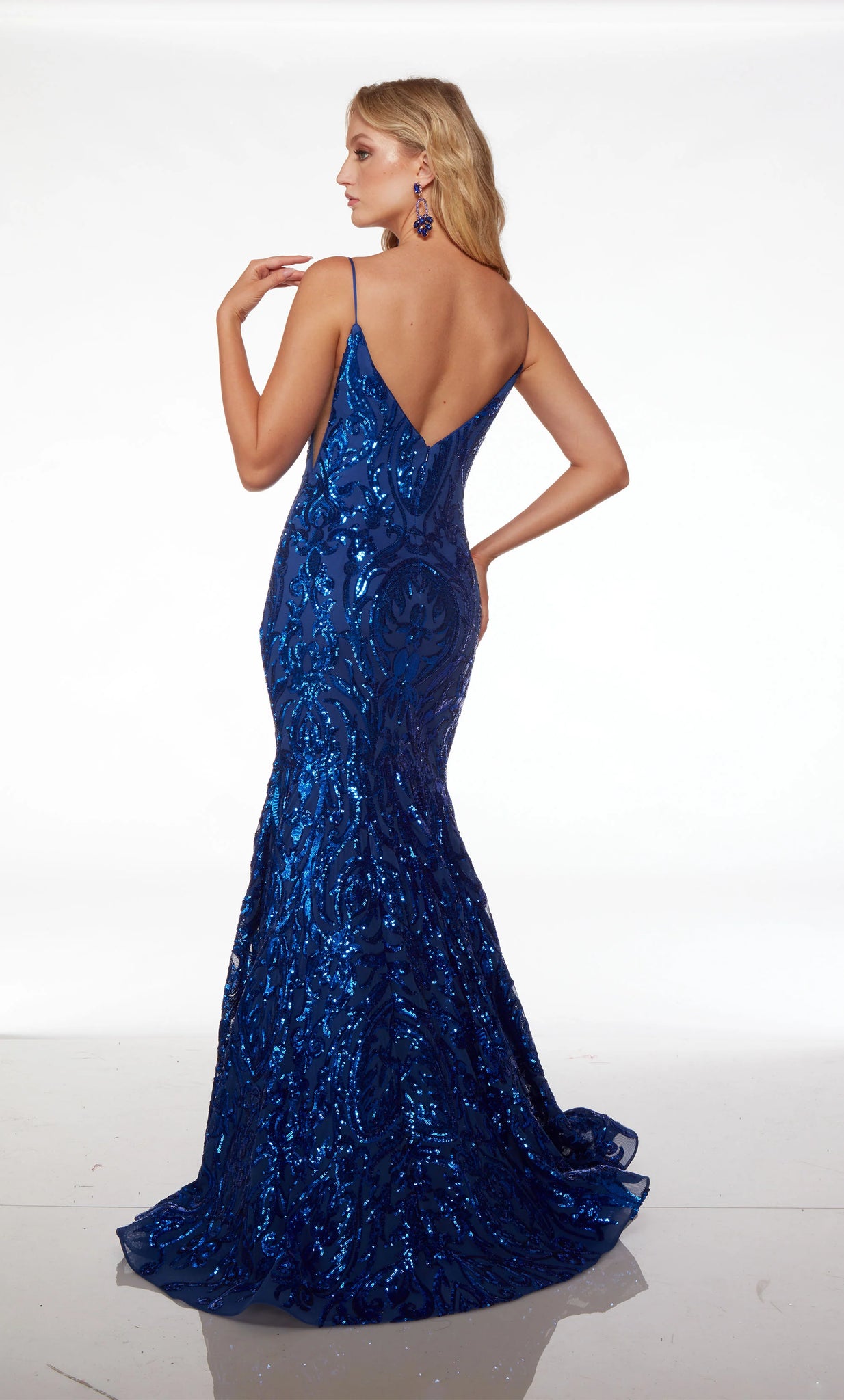 Turn heads when you step into the room wearing this captivating fully beaded Alyce Paris long prom dress 61607. The fitted zip up bodice features a trendy V neckline and the skirt has a long glistening sweep train. Whimsical sequin beaded patterns adorn the entirety of the dress giving you ideal radiance and detail.