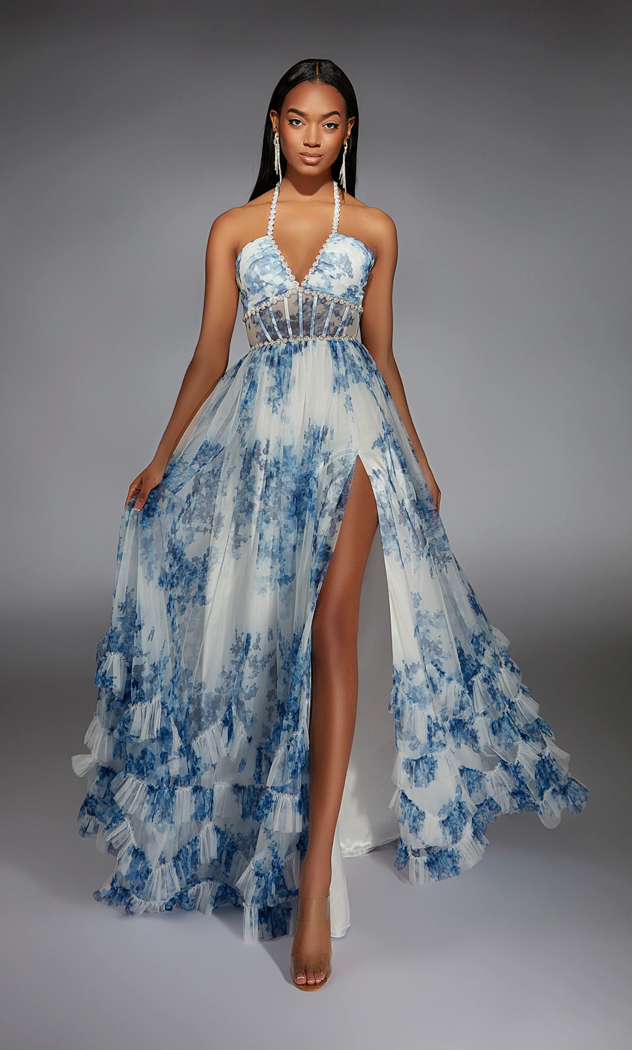 Feel like a modern day princess in this enchanting long dress by Alyce Paris, style 61757. Showcasing an a-line silhouette with a v halter neckline. The corset bodice is sure to snatch your waist in. This number is made out of gorgeous floral net material and glistening beadwork along the bodice. A thigh high slit is the perfect final touch.