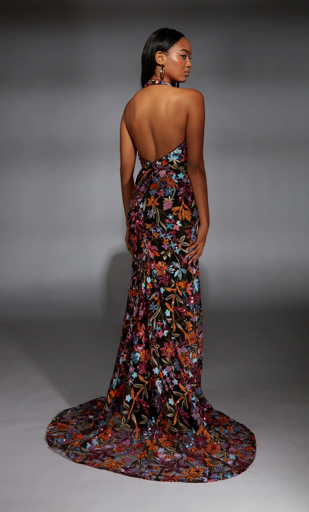 Look classy and sexy wearing Alyce Paris long dress 61813. The striking fitted dress reveals a daring plunging v neckline with thick halter straps showcasing an eye catching open back. The form fitted bodice and mesmerizing sweep train are decorated with multi colored floral detailing that will wow the crowd.