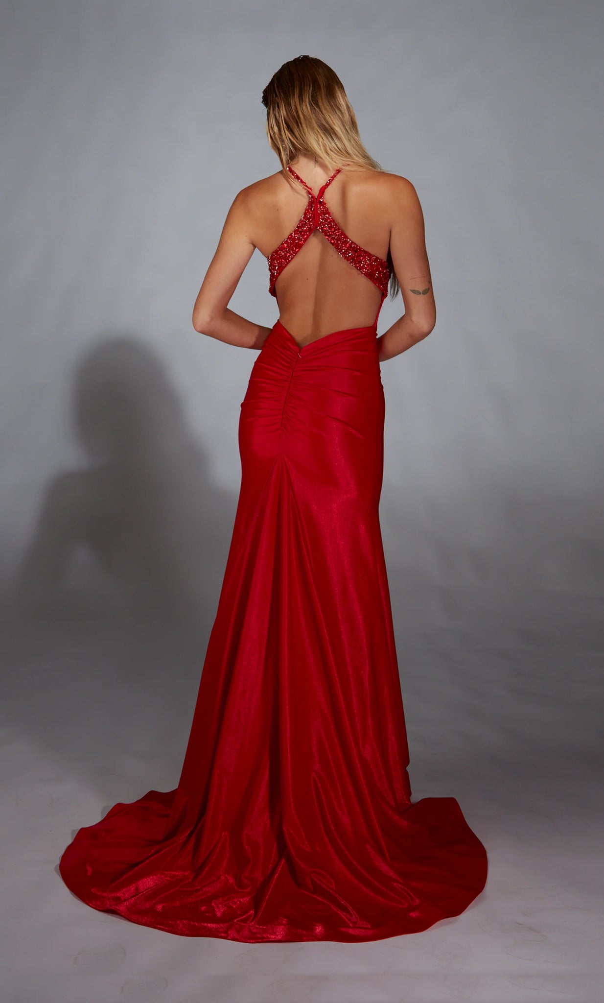 Look sleek and sophisticated wearing this elegant Alyce Paris&nbsp;long dress&nbsp;61820. This form fitting silhouette showcases a high halter neckline with a modest mesh key hole cut out, revealing an open back. The simple jersey material showcases the perfect amount of sparkle and sweep train for a finishing touch.