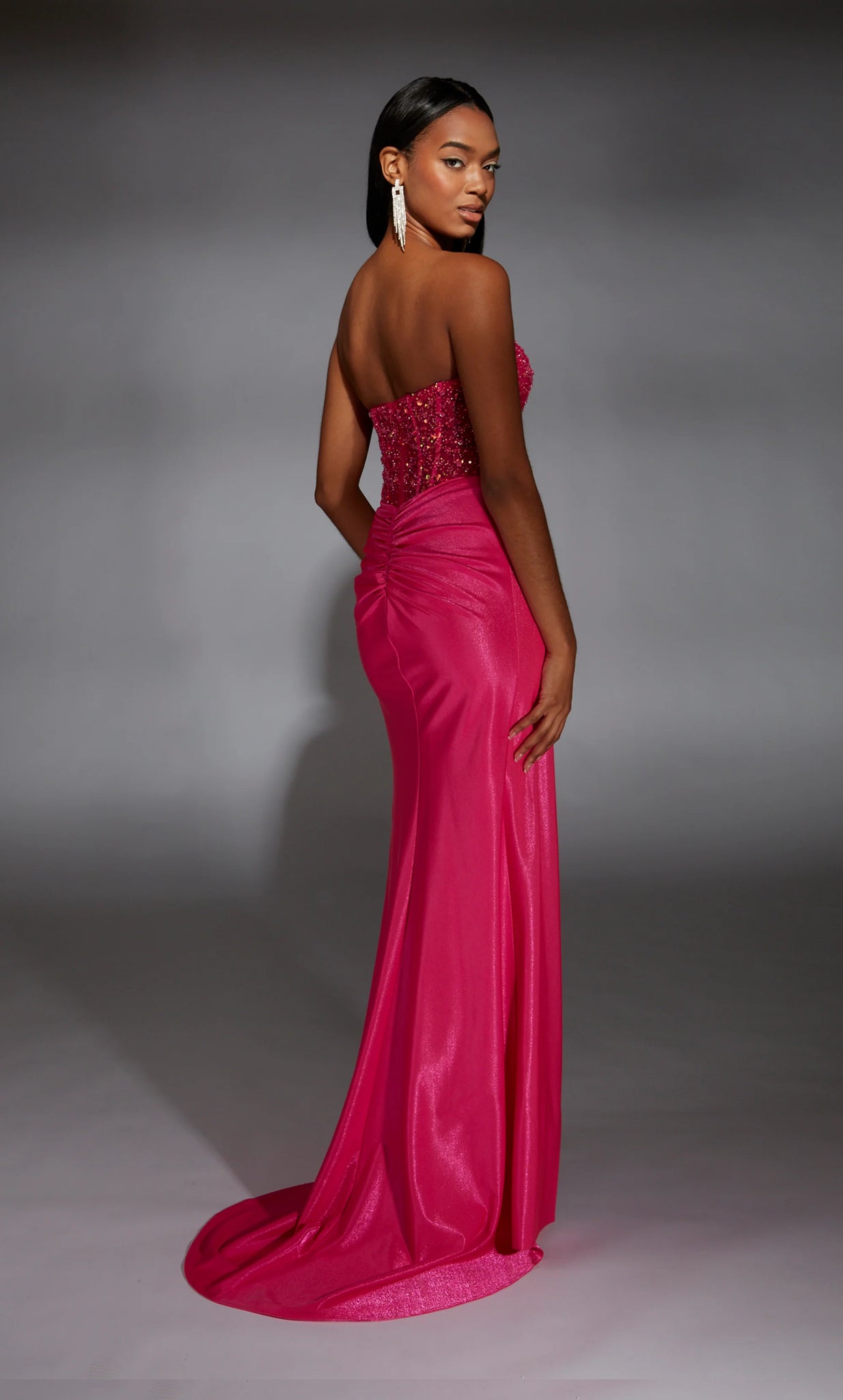 Draw the attention of the crowd as you walk the Prom stage wearing the sensational long style 61884 by Alyce Paris. The scoop neckline is paired with an illusion bodice displaying exposed boning and beautifully embellished with glistening beadwork all along the top. Headlining the jersey fitted skirt detailed with ruching along the midsection and lower backside. Followed by the perfect flyaway train.