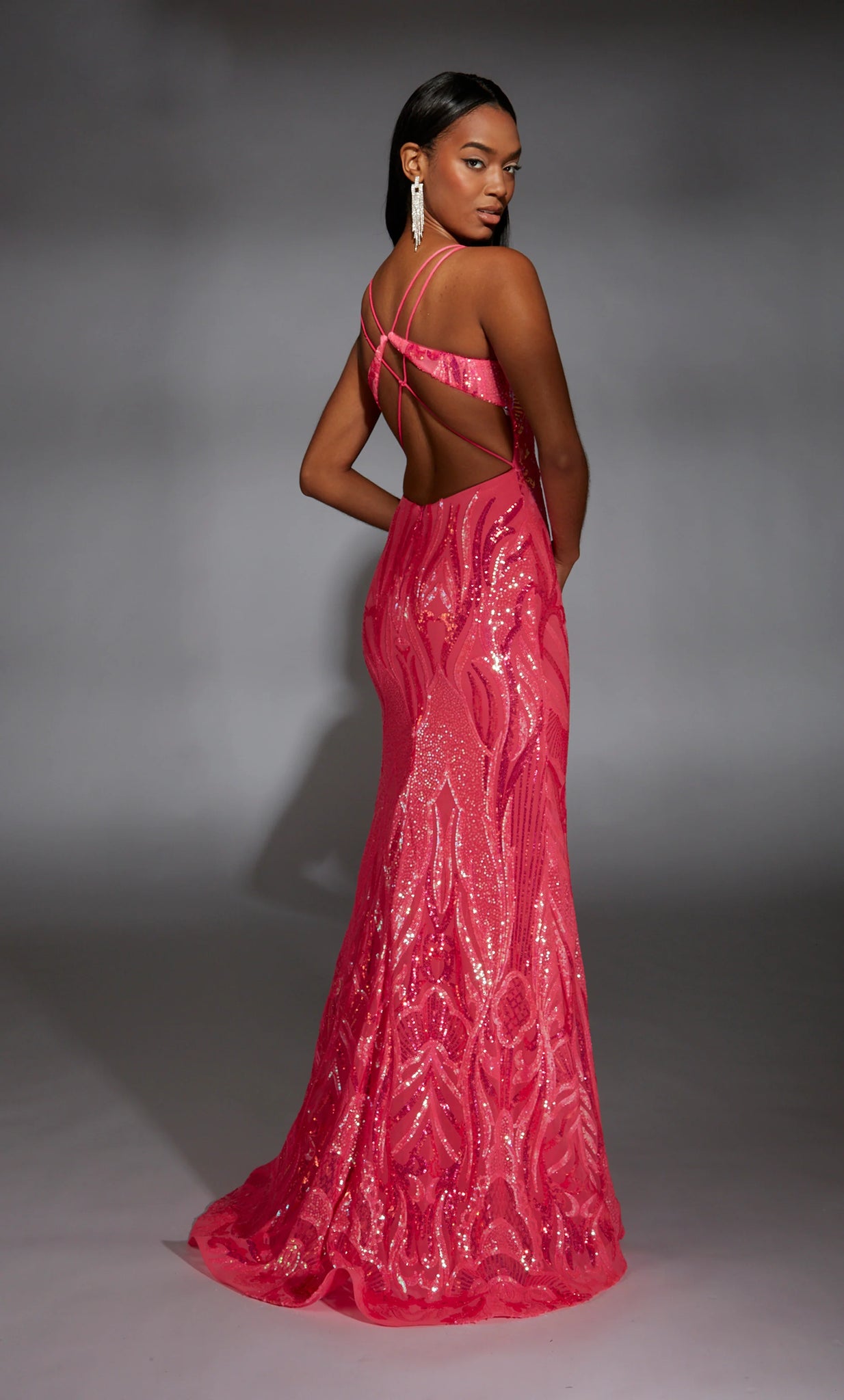Have all jaws drop as you enter the room wearing this glamorous long dress by Alyce Paris, style 61930. Showcasing a beautiful v neckline with straps that lead to an open back. The gorgeous beaded sequins pattern is extremely flattering and goes all the way to the hem of the dress.