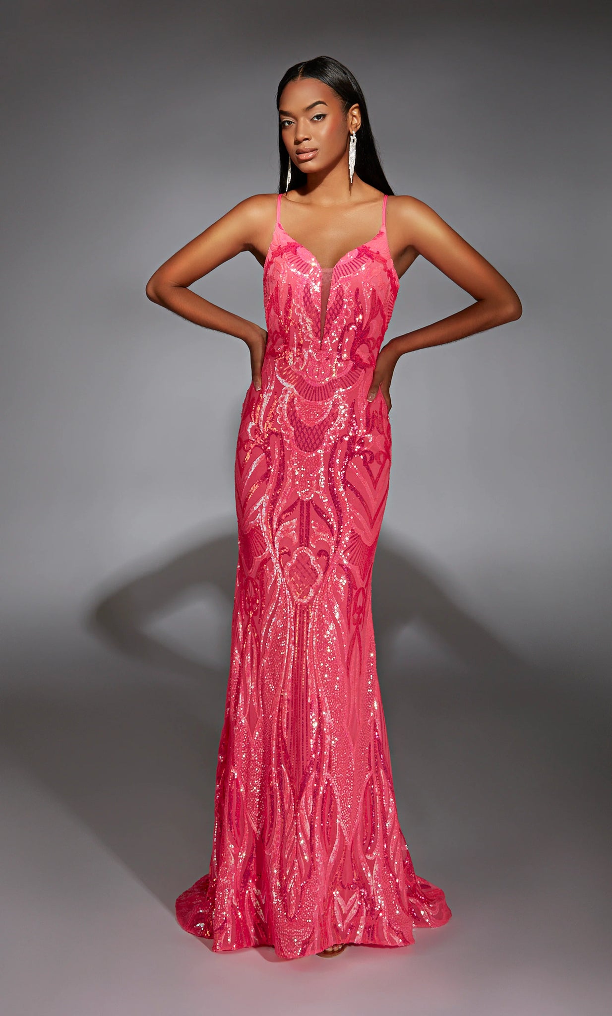 Have all jaws drop as you enter the room wearing this glamorous long dress by Alyce Paris, style 61930. Showcasing a beautiful v neckline with straps that lead to an open back. The gorgeous beaded sequins pattern is extremely flattering and goes all the way to the hem of the dress.