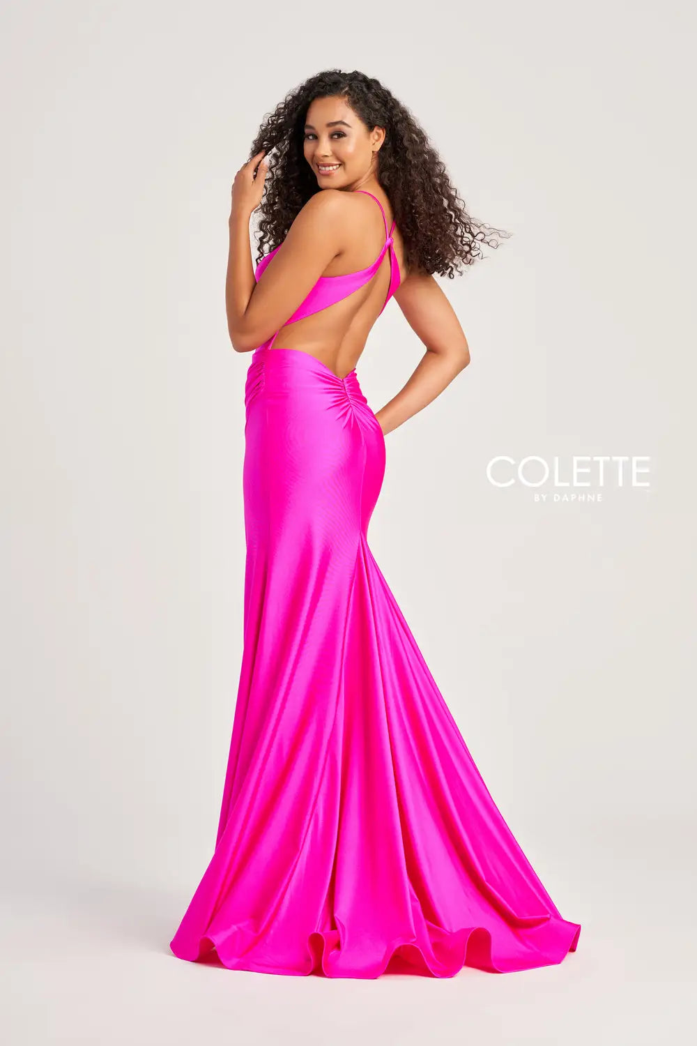 Be bold at your prom and get noticed in this glamorous Colette long dress style CL5204 made in hot colors of stretch jersey fabric. This sleek silhouette features a corset bodice with exposed boning, V neckline, spaghetti straps and large keyhole cutout back. The long curve hugging skirt has a high front side slit, horsehair hem edge and sweep train.
