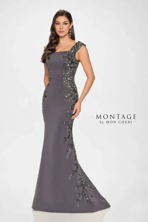 This gown exudes understated elegance. The softly structured bodice is beautifully adorned with delicate floral lace appliqué to highlight your waistline. The timeless bateau neckline and chic cap sleeves bring classic charm, while the fit-and-flare silhouette perfectly flatters your figure, delivering a look that’s both sophisticated and stunning.