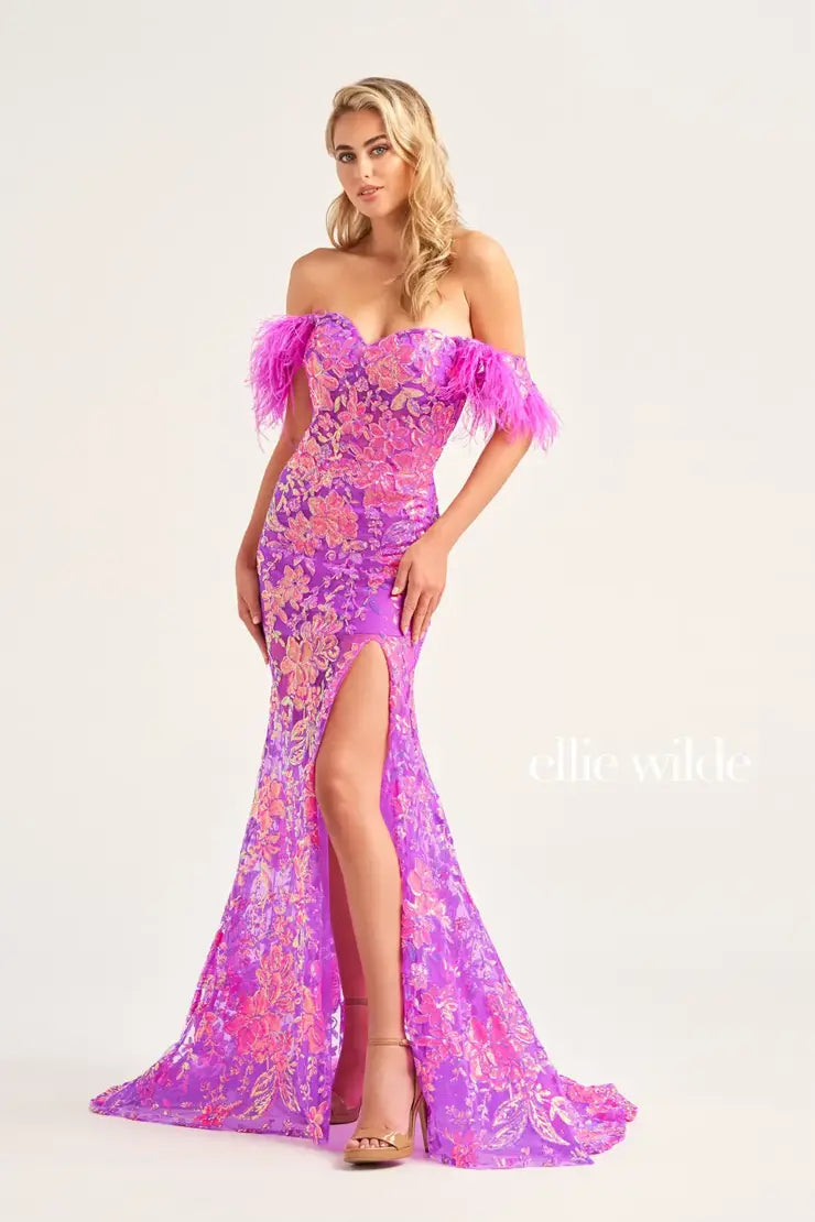 Stand out from the rest in this striking Ellie Wilde dress EW34034. This sweetheart neckline dress showcases a sheer illusion bodice adorn in sparkling appliques. Detachable off the shoulder sleeves are decked with feathers. The fitted skirt has a short under skirt and those glamorous sparkling appliques trickle all the way down to the hem.