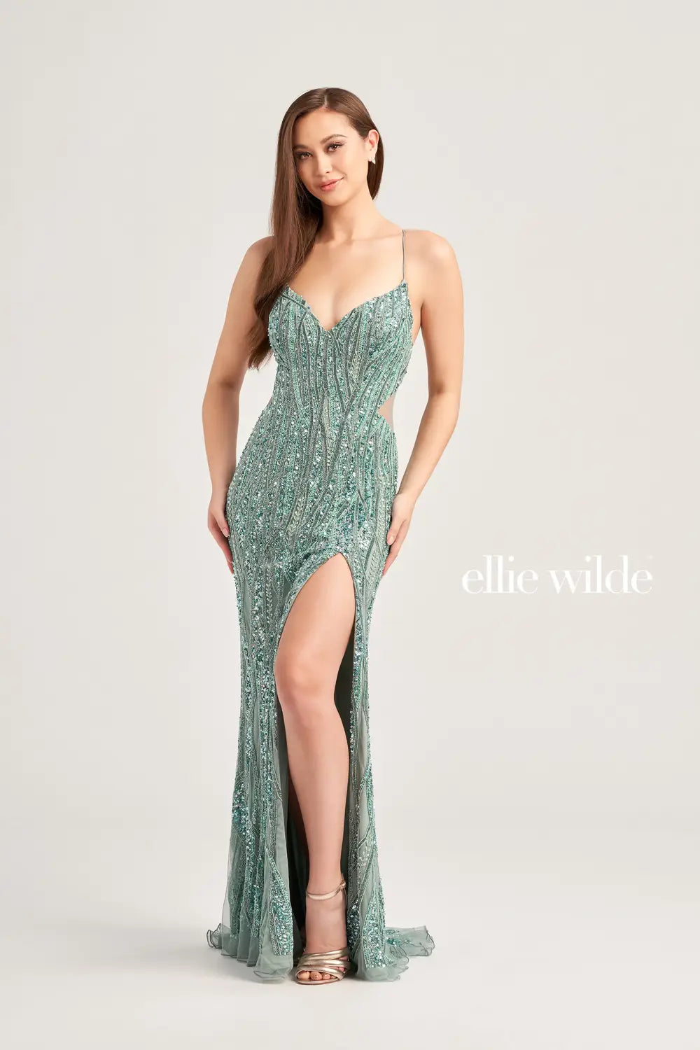 This Ellie Wilde style EW35023 is the perfect choice for your special event. The gorgeous fitted silhouette showcases a classic v neckline with simple straps flowing into a lace up open back for a perfect fit. Mixtures of stunning beadwork and dazzling sequins add the all over shimmer and sparkle that will have you being the talk of the night.