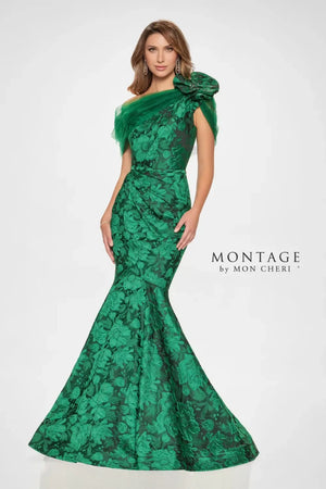 Turn heads in this striking trumpet. Its fitted bodice accentuates the waist, while the flared skirt gracefully cascades from the knees, creating that classic trumpet silhouette known for its flattering effect. The dramatic floral brocade adds depth and dimension, while the assymmetrical shoulder design with dreamy tulle and ruffle detail adds an extra touch of glamour. Remove the matching wrap for a sleek and sophisticated look that allows the intricate details of the gown to truly shine.