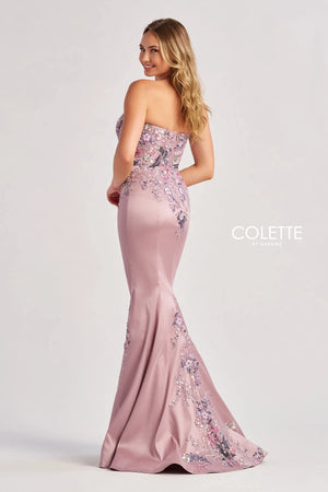 Amp up the drama when wearing this phenomenal long fitted mikado dress by Colette, style CL8410. Showcasing a strapless sweetheart neckline that comes with detachable spaghetti straps. This ensemble is had a beautiful bodice that will hug your waist gorgeously all time. Fully adorned with floral applique and unique beadwork going down the dress. For the perfect final touch it has a classy slit.