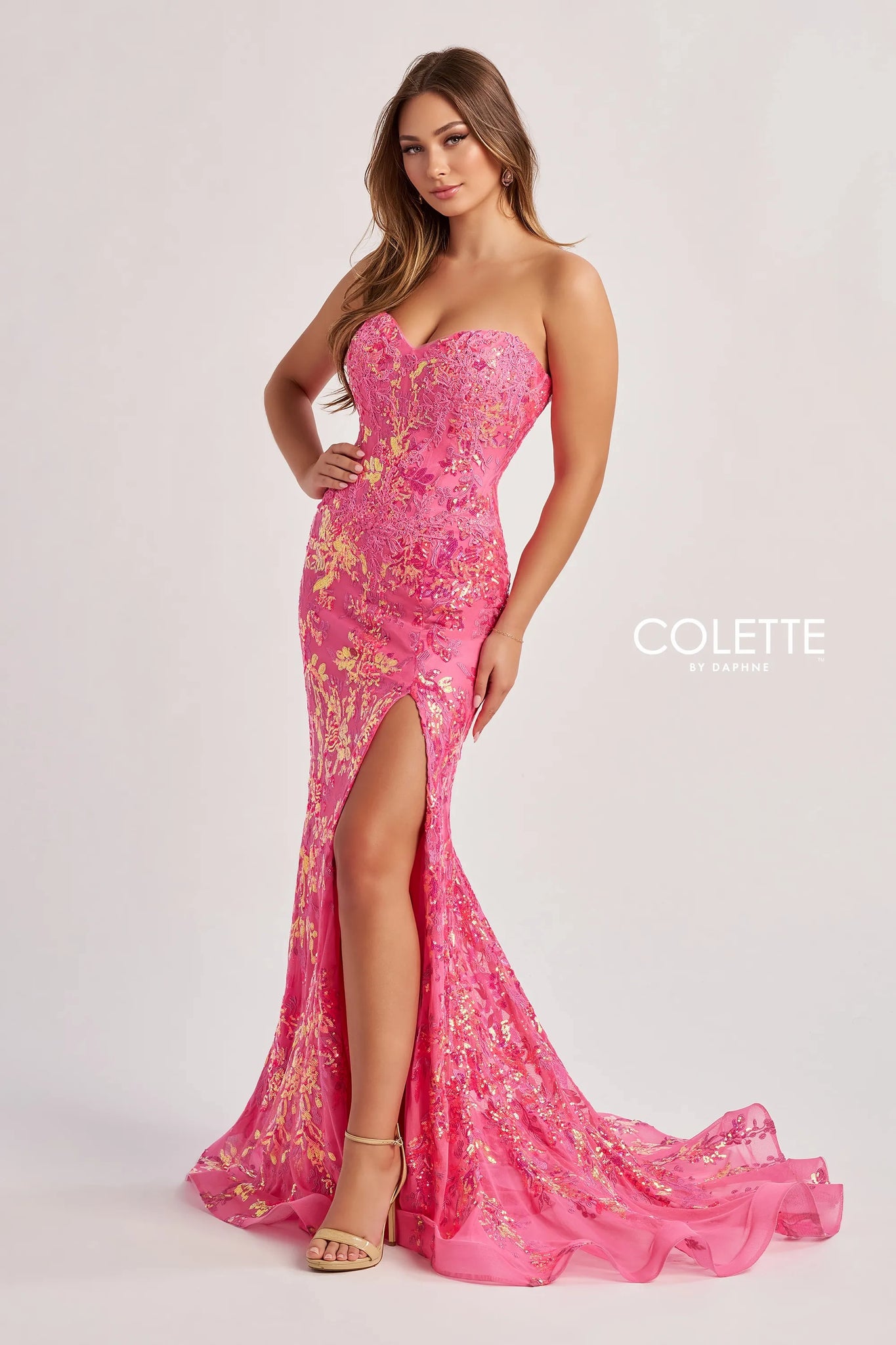 Have all eyes on you as you walk into the room wearing this glamorous long dress by Colette style CL8440. Showcasing a fitted silhouette with a strapless sweetheart neckline. This number is fully adorned with glistening beadwork, gorgeous applique and embroidery. A thigh high slit is the perfect final touch.