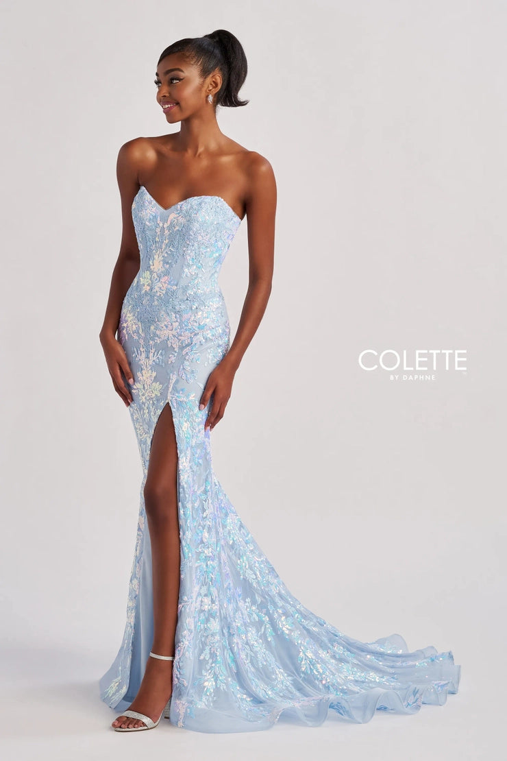 Have all eyes on you as you walk into the room wearing this glamorous long dress by Colette style CL8440. Showcasing a fitted silhouette with a strapless sweetheart neckline. This number is fully adorned with glistening beadwork, gorgeous applique and embroidery. A thigh high slit is the perfect final touch.