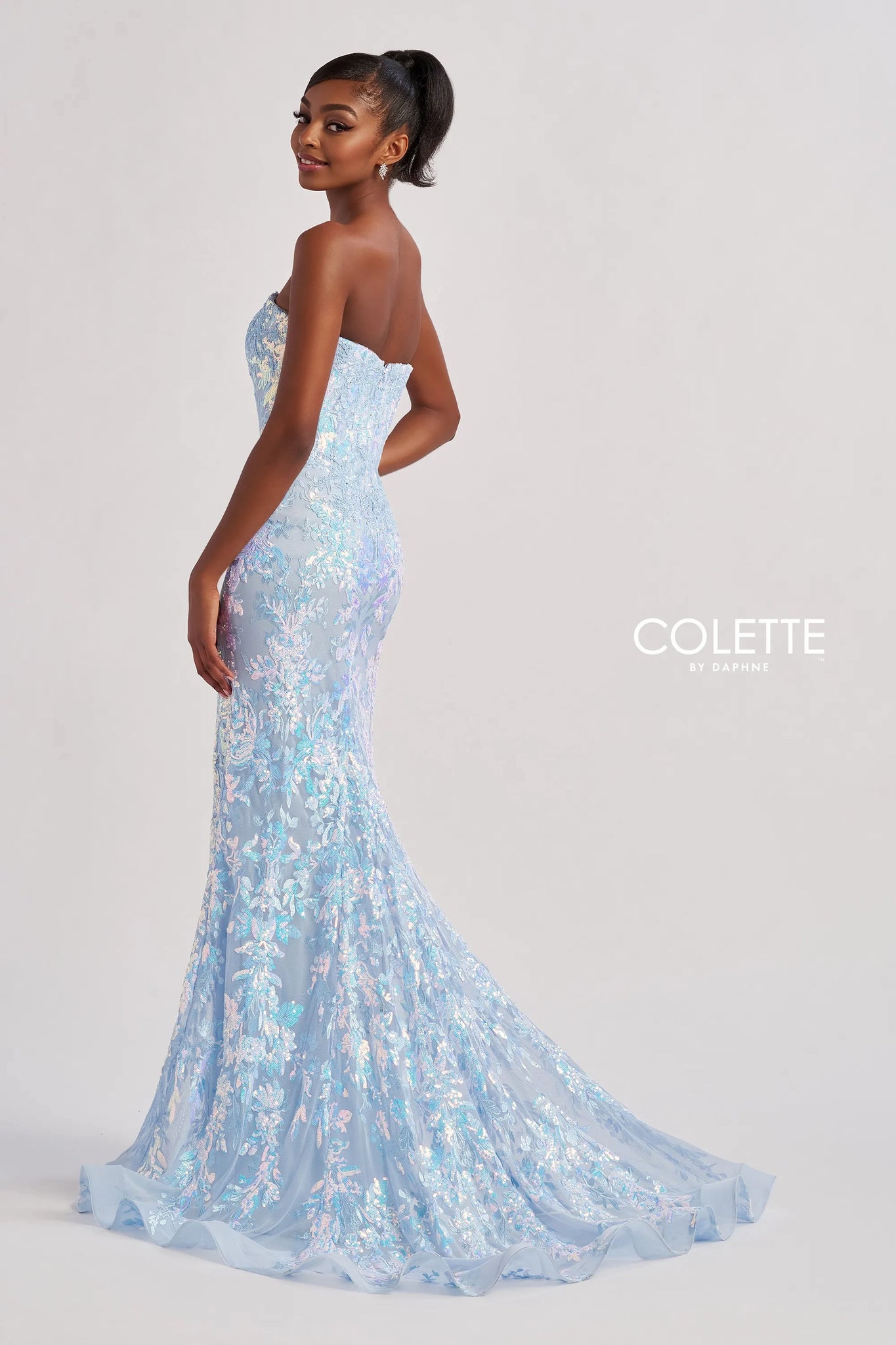 Have all eyes on you as you walk into the room wearing this glamorous long dress by Colette style CL8440. Showcasing a fitted silhouette with a strapless sweetheart neckline. This number is fully adorned with glistening beadwork, gorgeous applique and embroidery. A thigh high slit is the perfect final touch.