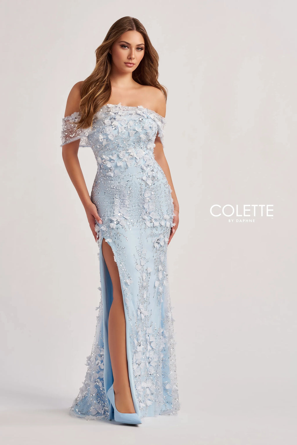 Elevate your romantic style with this enchanting long dress, crafted from exquisite beaded embroidery and shimmering sequin tulle. The fit-and-flare silhouette beautifully accentuates your figure, while the off-the-shoulder straight neckline adds a touch of elegance. Adorned with three-dimensional flowers, this dress features a daring slit for added allure. Complete with optional spaghetti straps and a natural waistline, it’s perfect for making unforgettable memories.