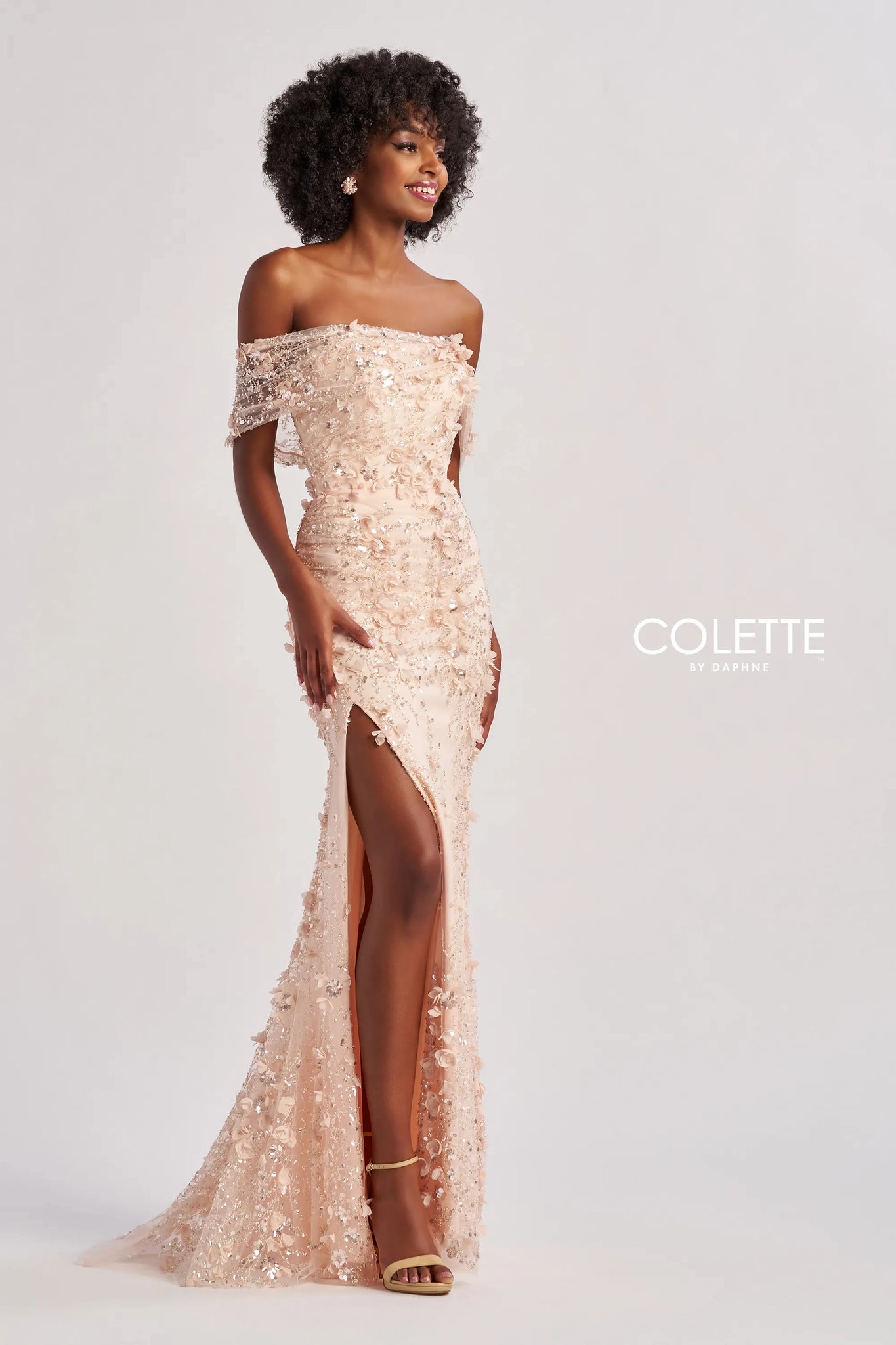 Elevate your romantic style with this enchanting long dress, crafted from exquisite beaded embroidery and shimmering sequin tulle. The fit-and-flare silhouette beautifully accentuates your figure, while the off-the-shoulder straight neckline adds a touch of elegance. Adorned with three-dimensional flowers, this dress features a daring slit for added allure. Complete with optional spaghetti straps and a natural waistline, it’s perfect for making unforgettable memories.