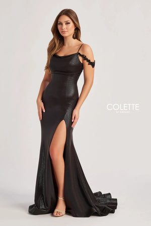 Look both classy and extravagant in this long and fitted dress made by Colette, style CL8565. This dress comes in two different colors which include a bold black and a fuchsia/hot pink. This dress is also off the shoulder with its cap sleeves that have lovely floral detailing. This dress has a perfect slit on the side and a long beautiful train that will have heads turning your way.