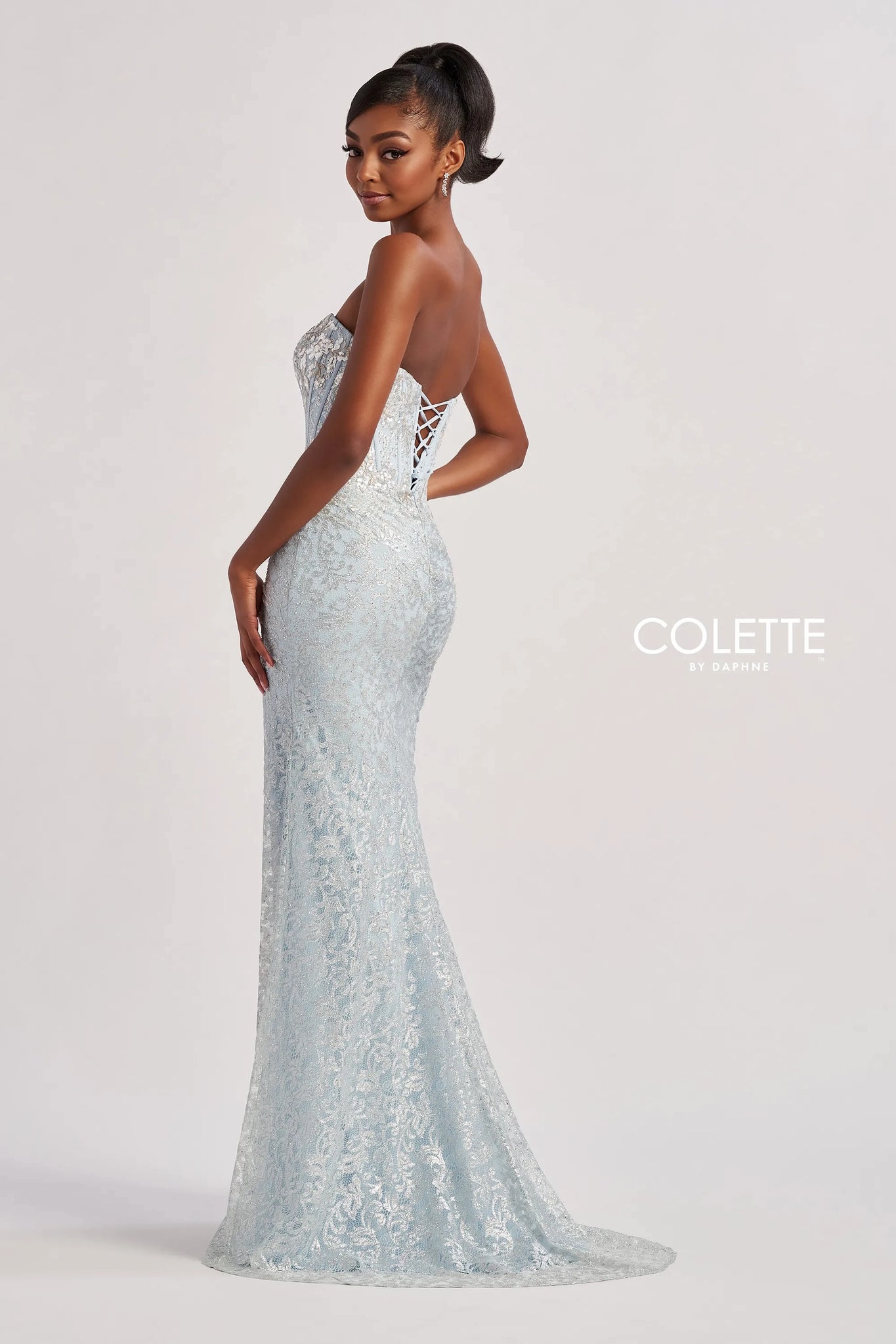 Have all eyes on you when wearing this phenomenal long dress by Colette, style CL8595. Showcasing a strapless modern neckline that comes with detachable straps leading to a sexy open corset lace up back that will hug your waist beautifully. Adorned with dazzling beadwork. The bottom is made out of stretchy lining lace material. Fully embellished with glistening sequins throughout the ensemble. For the perfect final touch it has a classy slit and a gorgeous train.