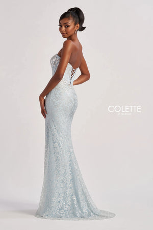 Have all eyes on you when wearing this phenomenal long dress by Colette, style CL8595. Showcasing a strapless modern neckline that comes with detachable straps leading to a sexy open corset lace up back that will hug your waist beautifully. Adorned with dazzling beadwork. The bottom is made out of stretchy lining lace material. Fully embellished with glistening sequins throughout the ensemble. For the perfect final touch it has a classy slit and a gorgeous train.
