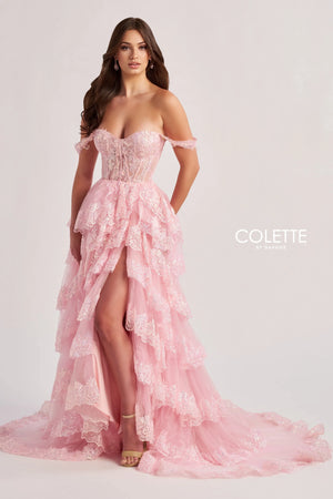 Make a glamorous entrance at your next special event in this stunning A line gown by Colette style CL8690. Showing an off the shoulder neckline adorning the fitted flattering corset bodice. A line skirt is adorned with a multi layered effect and beautiful thigh high slit and a stunning long sweep train.