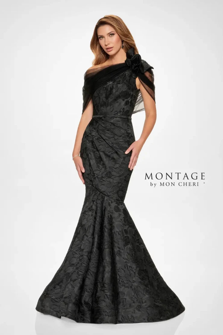 Turn heads in this striking trumpet. Its fitted bodice accentuates the waist, while the flared skirt gracefully cascades from the knees, creating that classic trumpet silhouette known for its flattering effect. The dramatic floral brocade adds depth and dimension, while the assymmetrical shoulder design with dreamy tulle and ruffle detail adds an extra touch of glamour. Remove the matching wrap for a sleek and sophisticated look that allows the intricate details of the gown to truly shine.