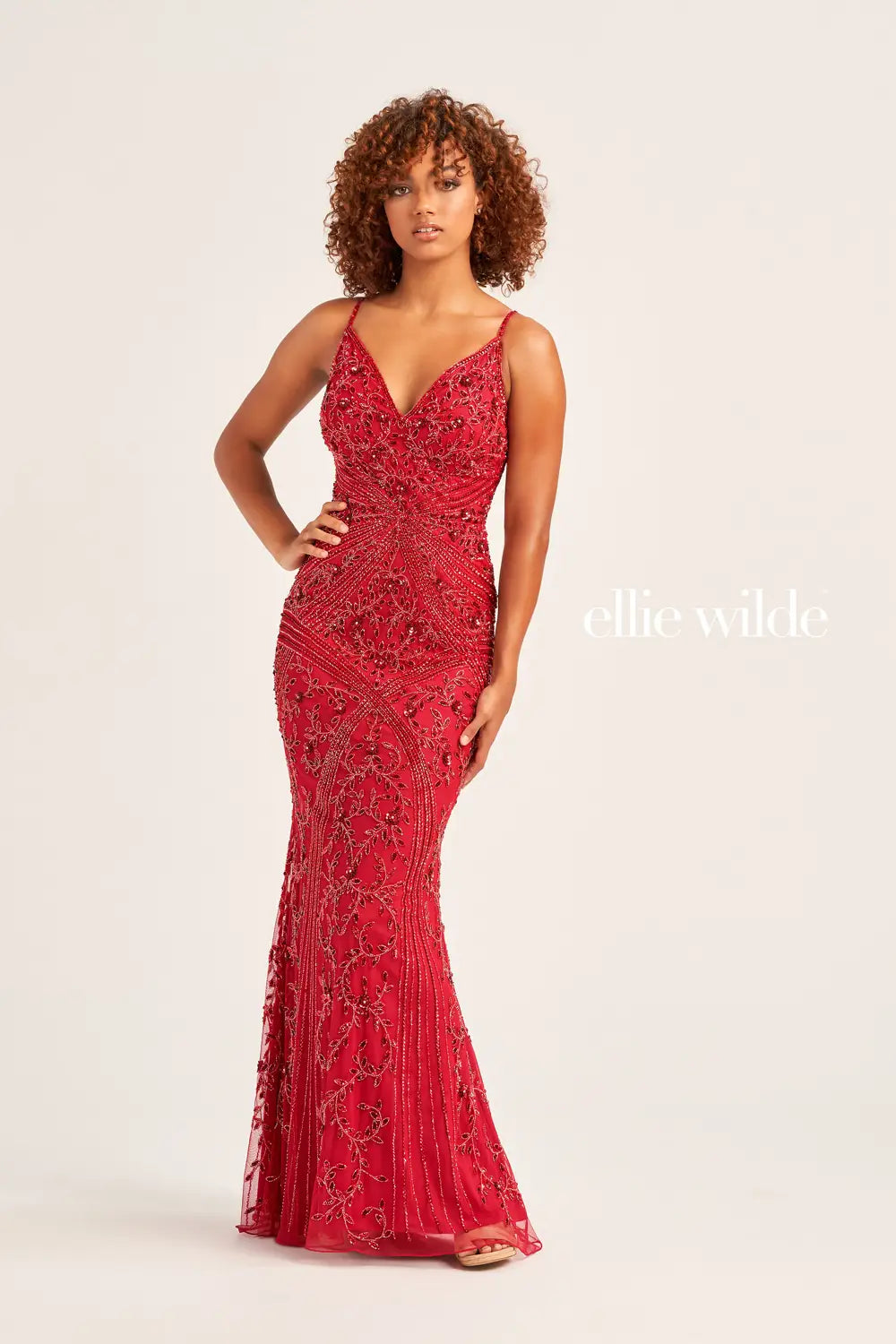 Have an everlasting sparkle when you wear this fully beaded Ellie Wilde prom dress EW35065. This fitted dress features an adjustable fitted bodice with a V-neckline that features adjustable shoulder straps for the perfect fit. Symmetrically sewn beaded patterns give you a radiant shine throughout the entire dress.