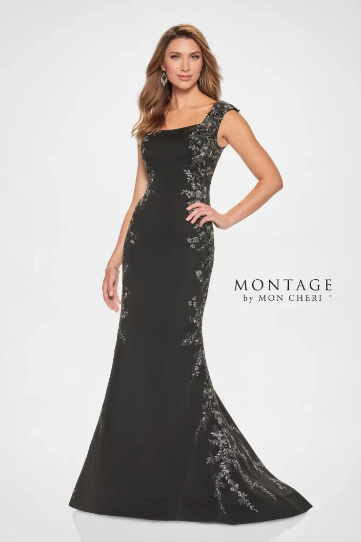 This gown exudes understated elegance. The softly structured bodice is beautifully adorned with delicate floral lace appliqué to highlight your waistline. The timeless bateau neckline and chic cap sleeves bring classic charm, while the fit-and-flare silhouette perfectly flatters your figure, delivering a look that’s both sophisticated and stunning.