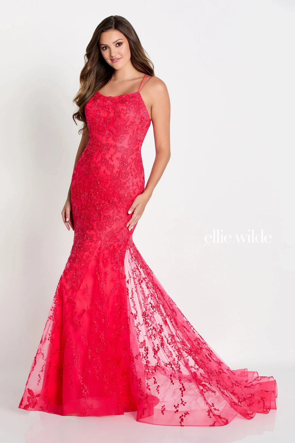 Feel like a true princess on your special night with the Ellie Wilde EW122032 dress. This captivating lace gown exudes romance and femininity, hugging your curves in all the right places. The mermaid silhouette highlights your figure, while the corset lace-up back adds a touch of allure. With its sweetheart bodice and delicate straps, this dress is the epitome of elegance. The floor-length skirt kicks out gracefully, creating a regal train that will leave everyone in awe. 