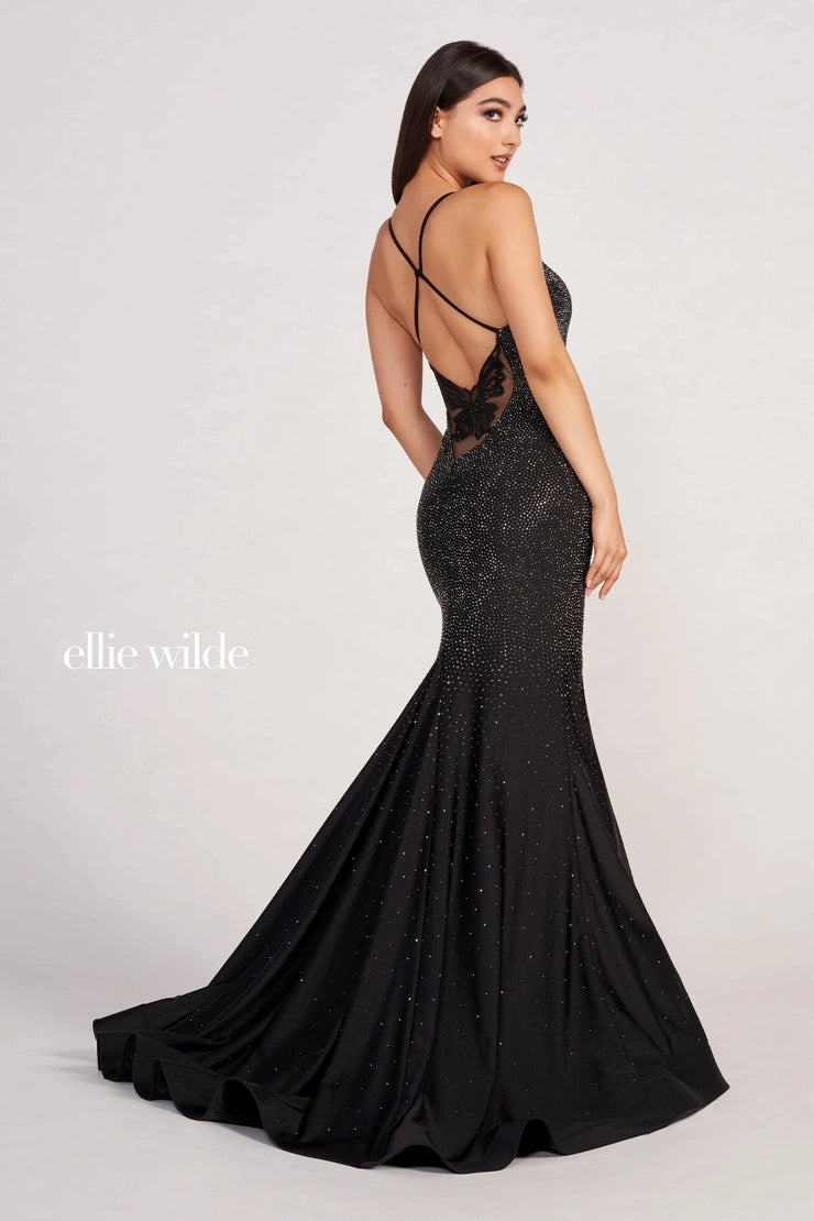 Leave an everlasting impression at your next special event in this jaw dropping long dress EW34005 by Ellie Wilde. Featuring a plunging neckline with simple straps that connect along the back, and are accompanied with a lovely butterfly design on the lower back. Fitted bodice is fully garnished with hot stones that trickle down the fitted and begin to fade out at the eye catching train.