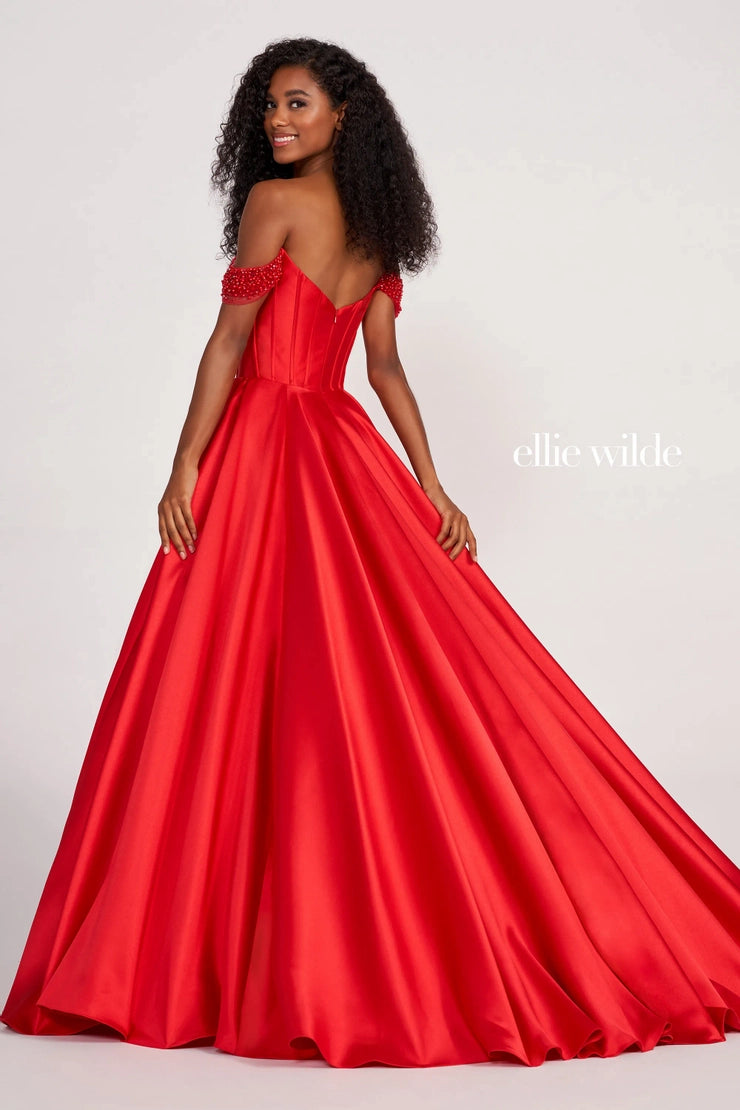 Elegant and classy ball gown dress EW34118 by Ellie Wilde is the perfect dress for your occasion. This alluring dress consists of an on trend corset bodice with an off the shoulder sweetheart neckline that features glistening beads that transition onto the off the shoulder cap sleeves. The voluminous mikado skirt features pockets and is made from layers of tulle and topped with a sleek shining mikado fabric.