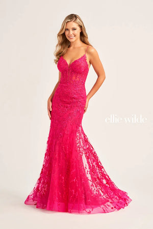 Make a stunning entrance at your upcoming event in this beautiful long gown by Ellie Wilde 35010. Showcasing a classy deep v cut neckline with a mesh insert and two supportive thin straps. The fit and flare silhouette will hug your curves and show off your hourglass figure. Adorned entirely in a glitter embroidery for the perfect amount of drama.