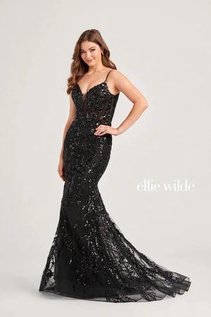 Sparkle from head to toe in this stunning Ellie Wilde dress EW35039, The fitted bodice is made from a sheer illusion material with gorgeous sequins appliques that adorn the bodice. Those matching appliques travel down all the way to the hem of the fit and flare silhouette. The back details has a cross band with a key hole opening.